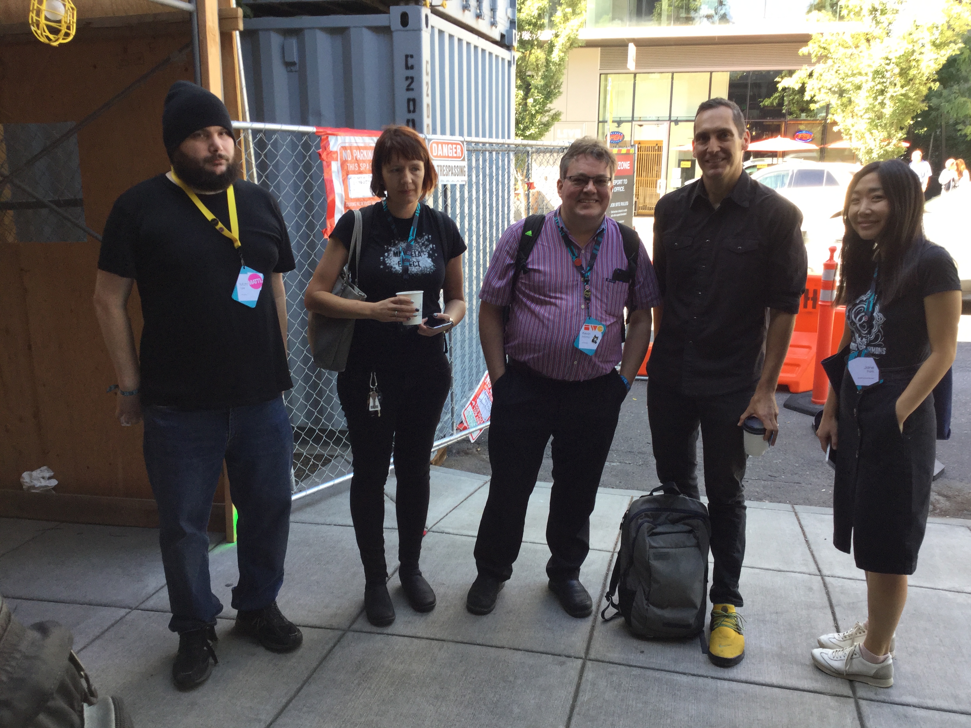 IndieWeb folks at XOXO Social, standing and posing for a photo just outside Cup and Bar cafe, including Matt Lee, Kevin Marks, a few Creative Commons folks