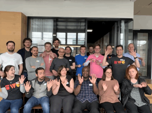Happy & waving participants of IndieWebCamp Berlin 2019