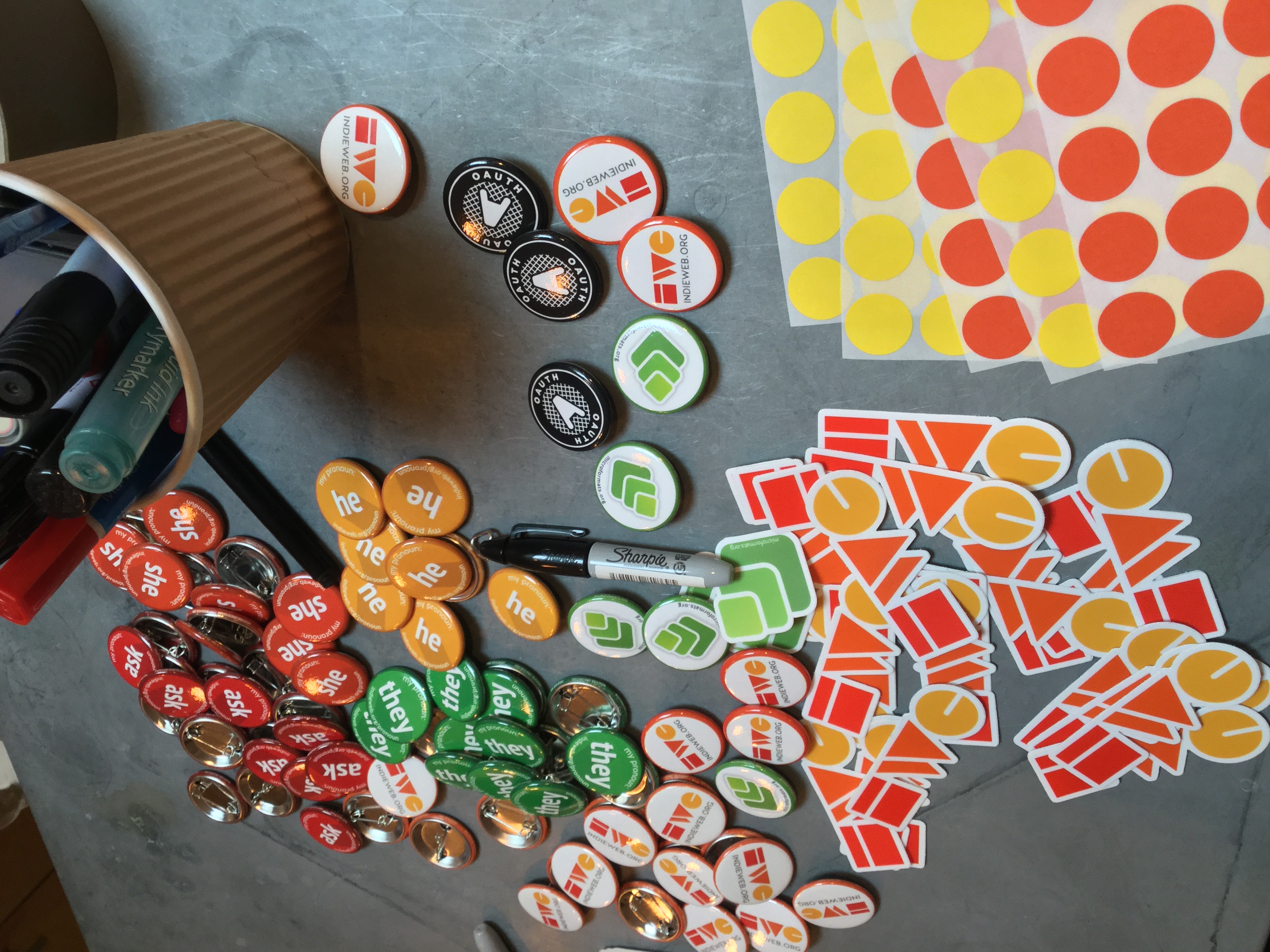 IndieWeb pins and stickers at IndieWebCamp Brighton registration