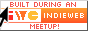 built during an IndieWeb meetup button with arrow, white with red text