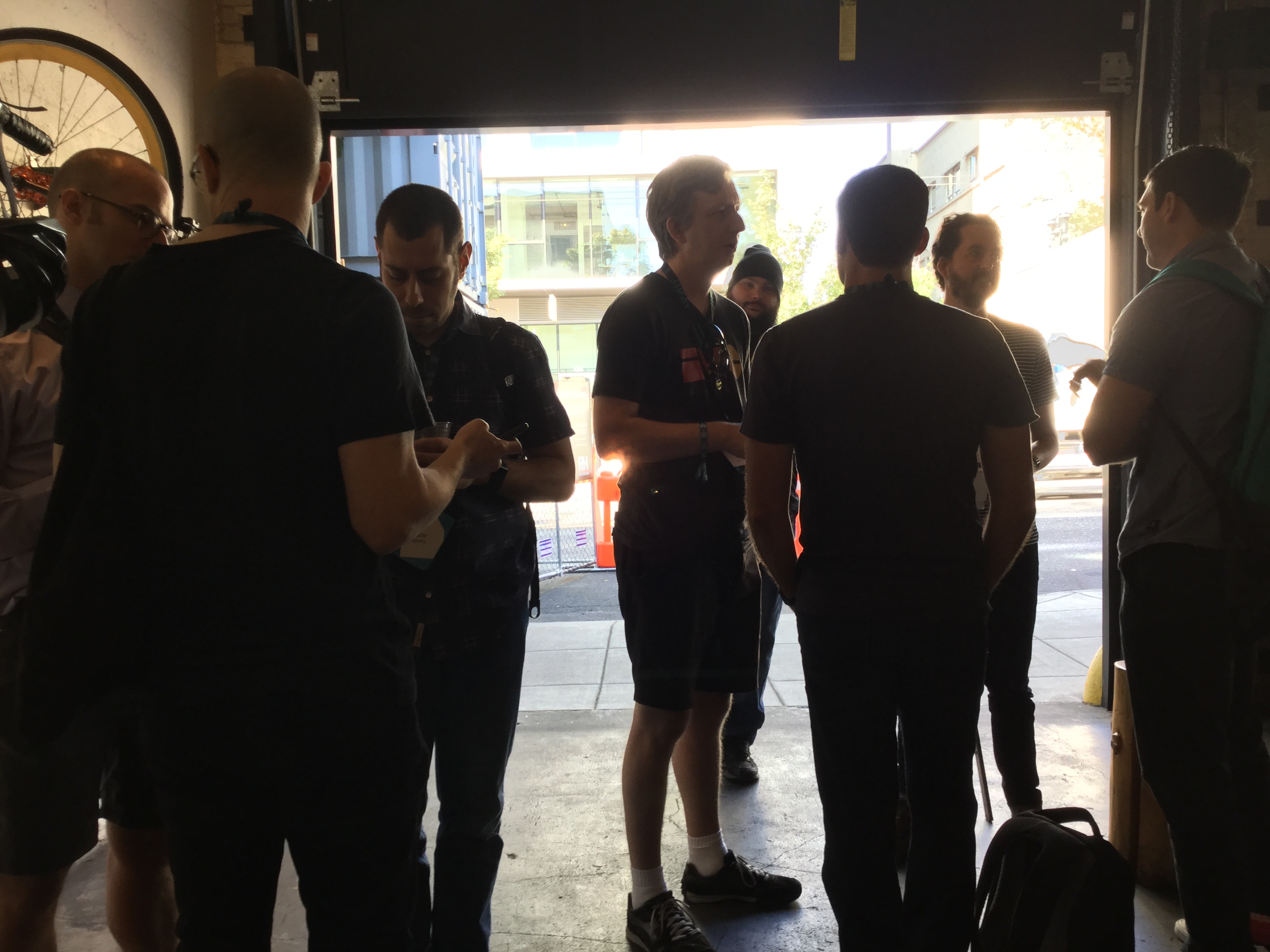 IndieWeb folks at XOXO Social, Cup and Bar cafe, mostly standing and having animated discussions including Matt Lee, gRegorLove