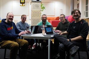 The participants of HWC Nuremberg 11/2024 sitting around a table.