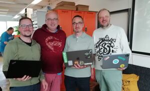 The crew of Homebrew Website Club Nuremberg 2024-06-12. 4 people with laptops standing in Fab Lab Nuremberg..
